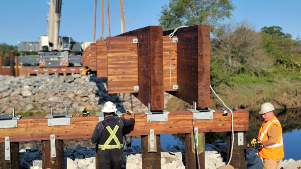 Crew load-testing the completed Dillmans Bridge, Meaghers Grant, Nova Scotia
