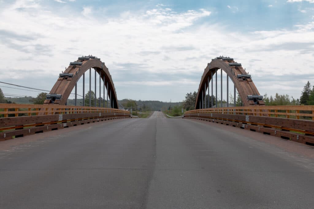 Road approach to the completed three-lane Roger Bacon timber bridge, Nova Scotia