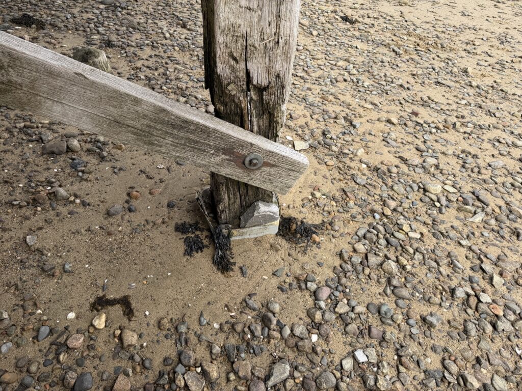 Damaged timber support beam beneath Duxbury Bridge