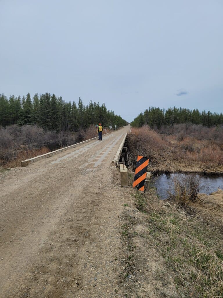 A worker on the road deck of the Meadow Lake bridge